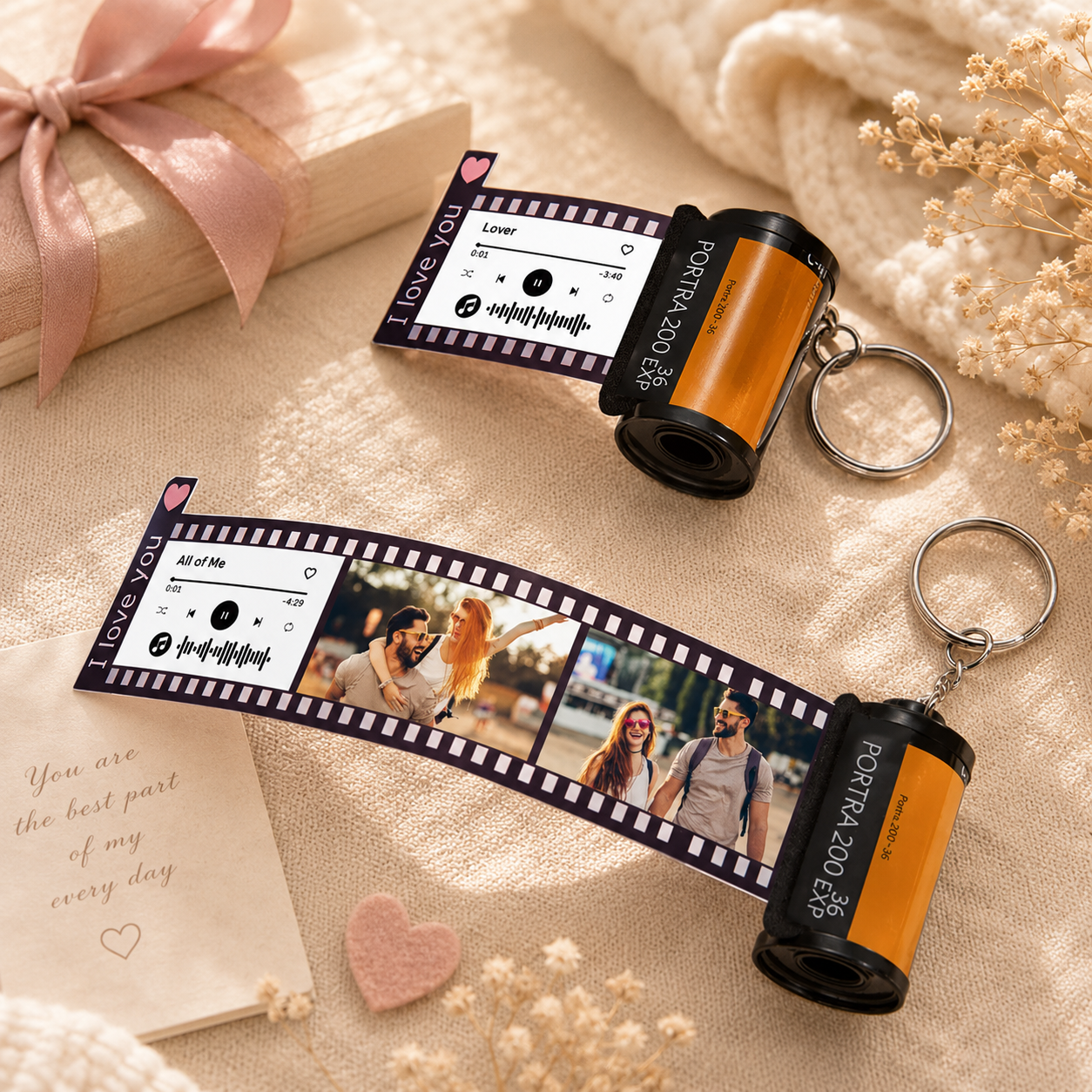 Film strip keychain with roll of film on a soft beige background