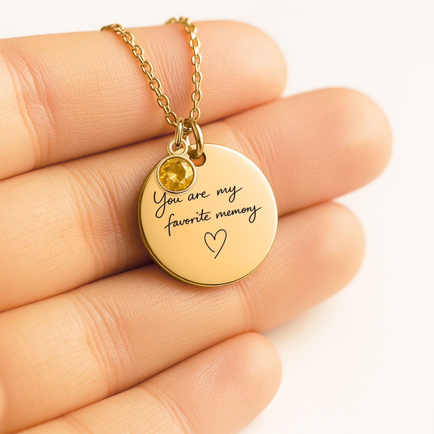 Close up of personalized You Are My Favorite Memory birthstone necklace showing handwritten engraving and birthstone charm