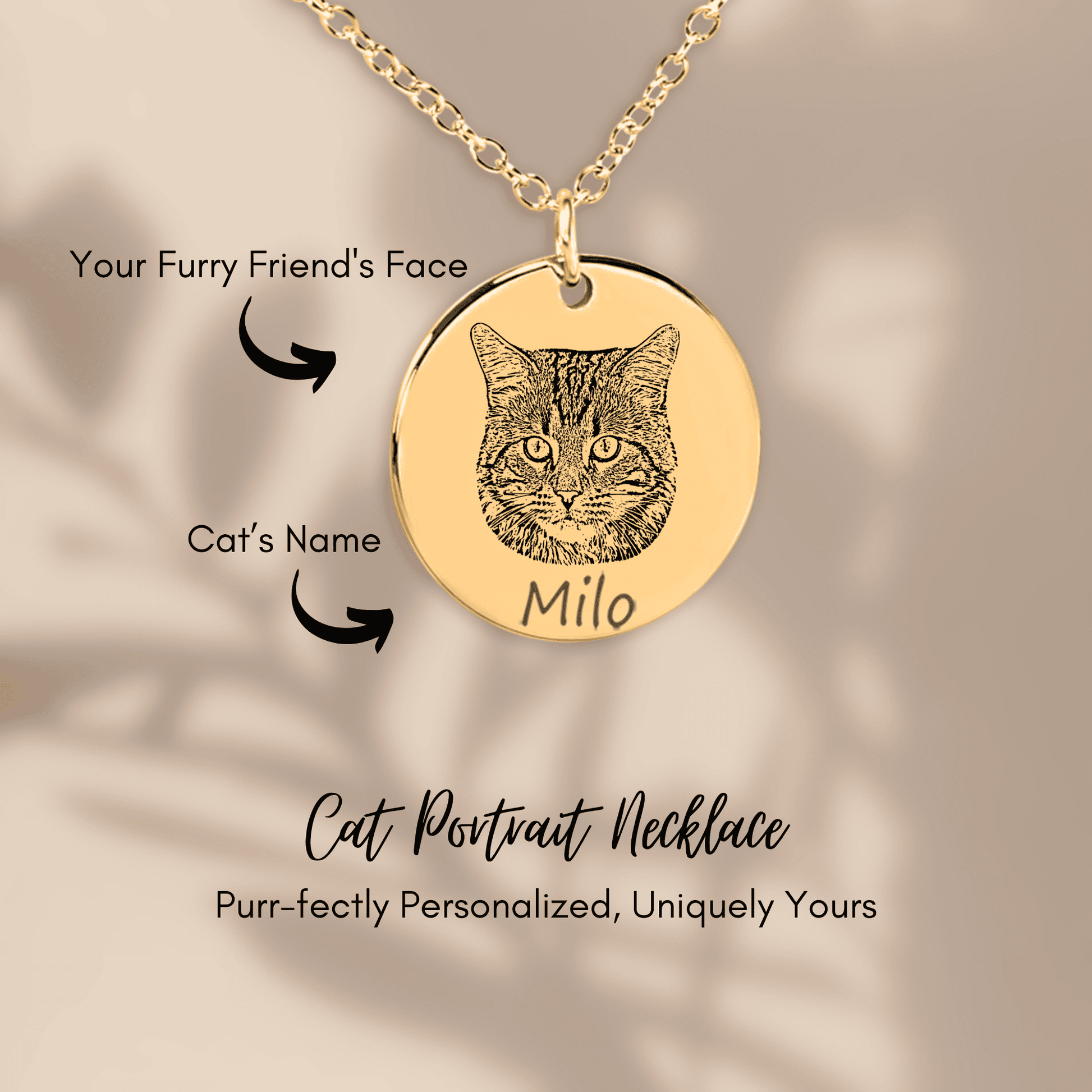 Gold cat portrait necklace with engraved face and name on a beige background