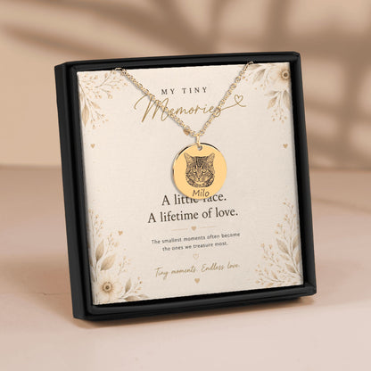 Personalized gold cat portrait necklace displayed in a luxury gift box with a sentimental message card and soft floral details.